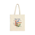 White cotton canvas tote bag featuring a New York transit map design with watercolor lines and neighborhood station names.