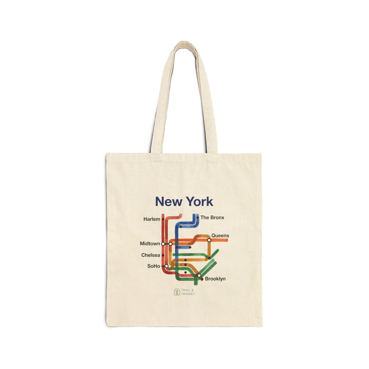 White cotton canvas tote bag featuring a New York transit map design with watercolor lines and neighborhood station names.