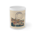 White 11oz ceramic mug featuring a vintage postage stamp illustration of the Lisbon skyline in watercolor with a postmark.