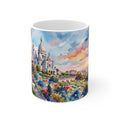 White 11oz ceramic mug featuring a vivid watercolor painting of the Sacré-Cœur basilica in Paris with a blurred 3D effect.