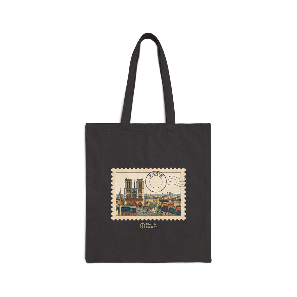 Cotton canvas tote bag featuring a vintage-style postage stamp with a watercolor illustration of the Paris skyline.