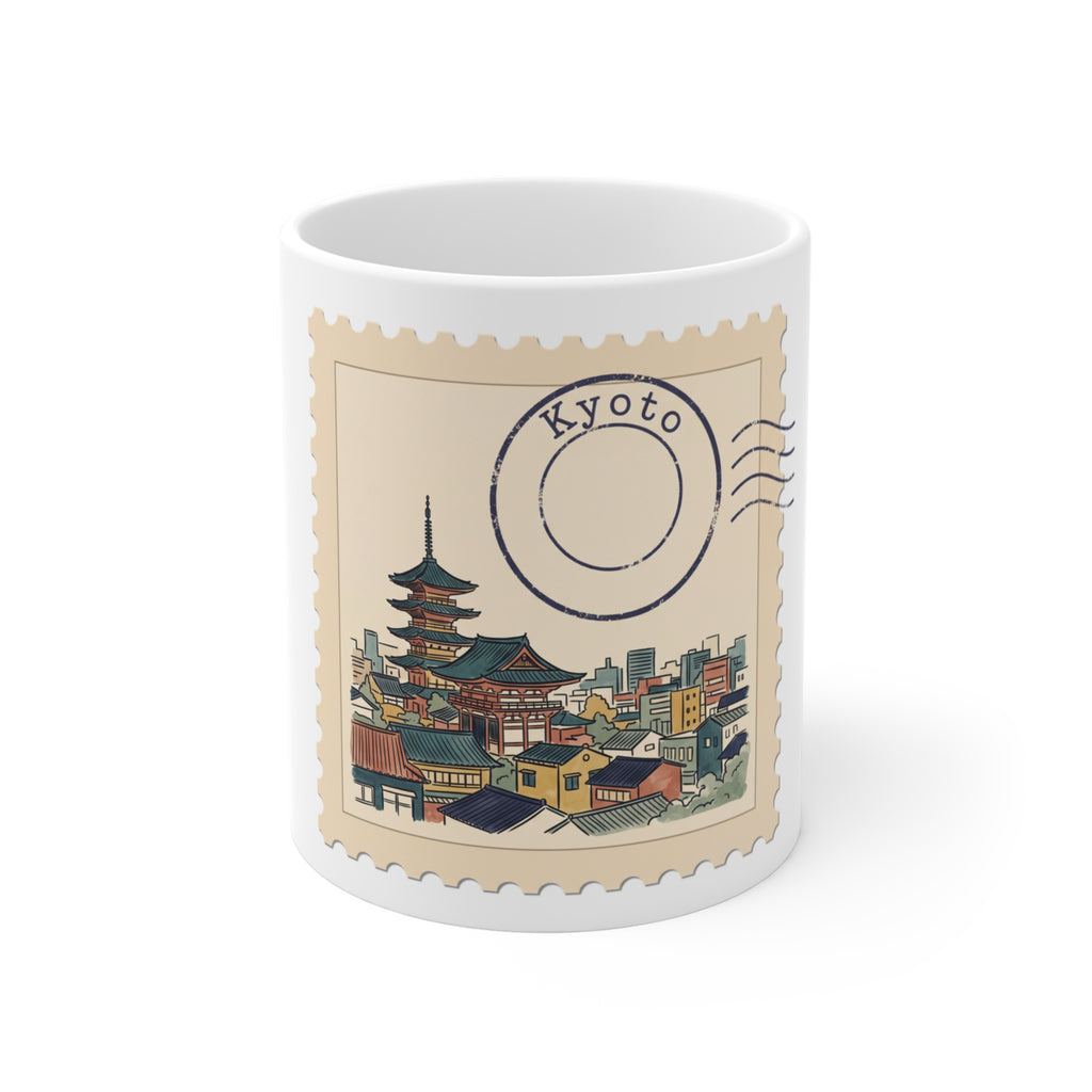 White 11oz ceramic mug featuring a vintage postage stamp illustration of a Kyoto skyline in watercolor with a navy postmark.