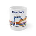 11oz white ceramic mug featuring a New York transit map design with watercolor lines and neighborhood stops like SoHo.