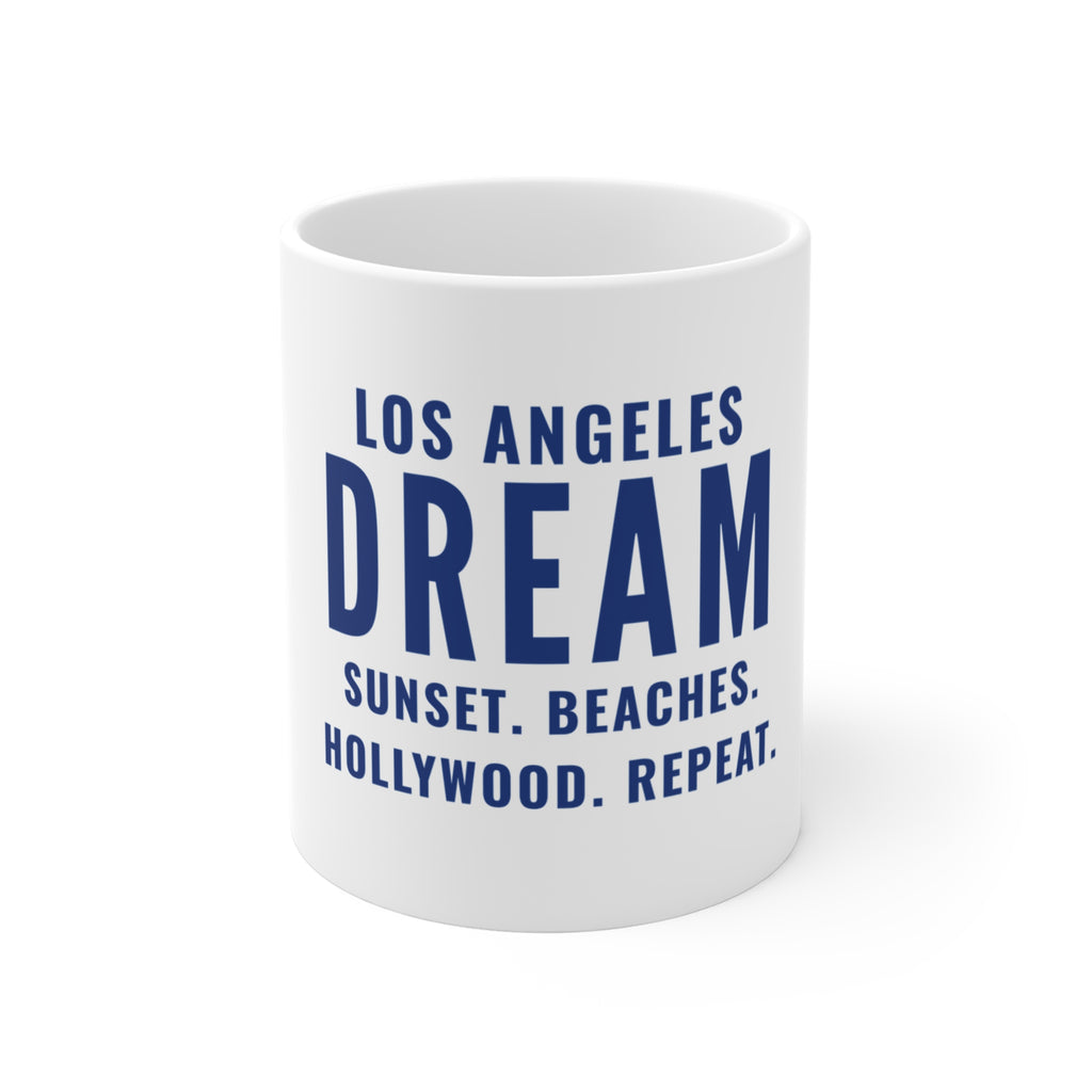White 11 oz ceramic mug printed in navy type: Los Angeles Dream, Sunset. Beaches. Hollywood. Repeat.